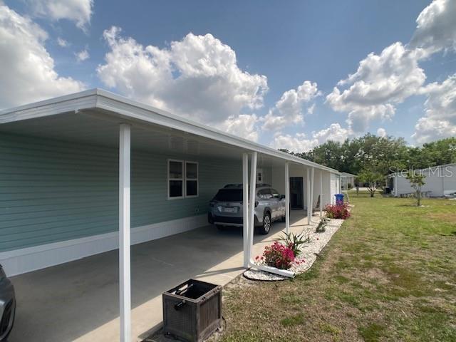 1710 7th Street Southwest, Unit 24 Ruskin, FL 33570 - Photo 4 of 44 a outdoor space with the couches and potted plants