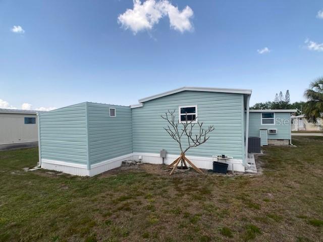 1710 7th Street Southwest, Unit 24 Ruskin, FL 33570 - Photo 41 of 44 a view of a house with a backyard