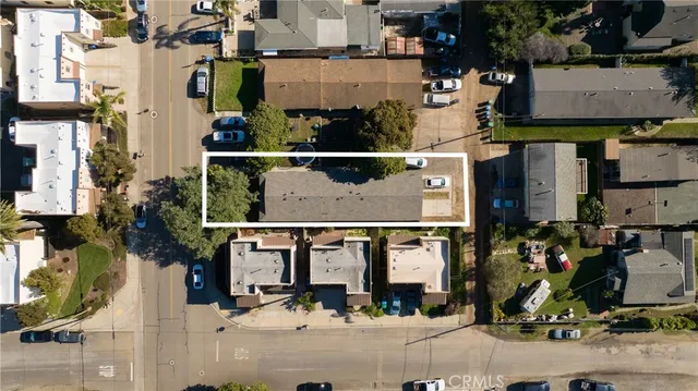 an aerial view of houses with street