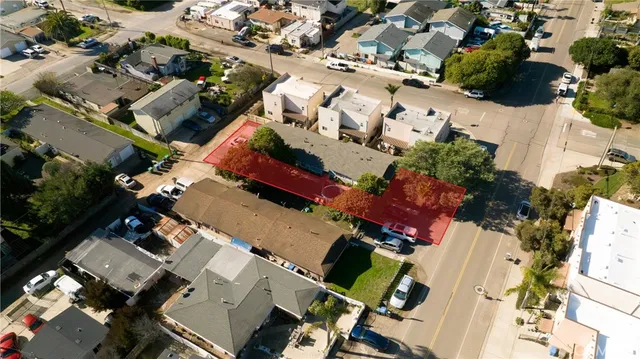 an aerial view of a houses with yard