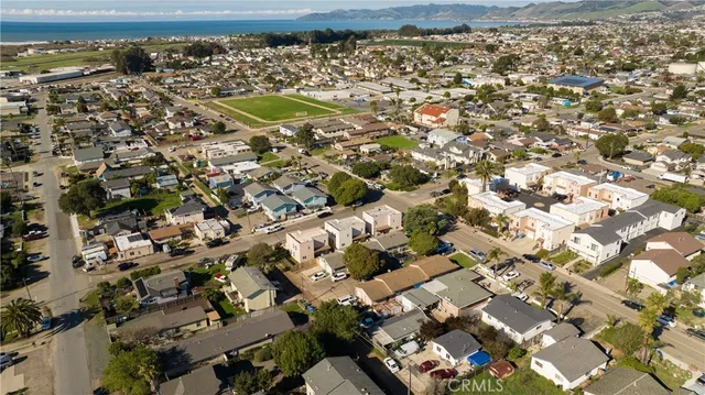 an aerial view of a residential houses with outdoor space