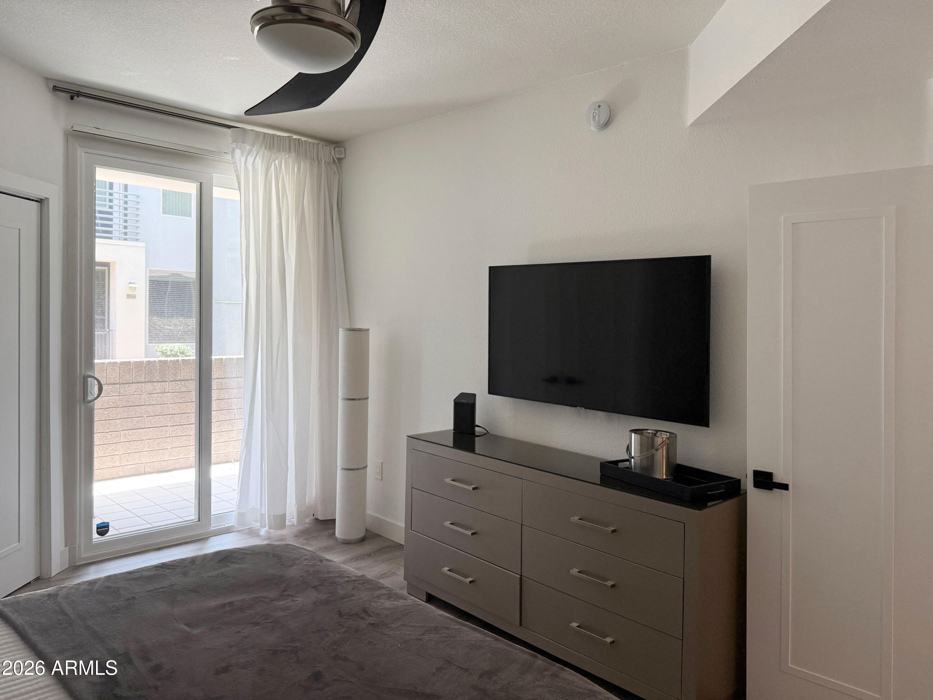 3633 North 3rd Avenue, Unit 1027 Phoenix, AZ 85013 - Photo 10 of 29 a living room with flat screen tv and a window