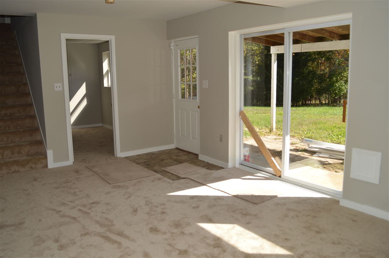 12084 Cross County Road Mineral, VA 23117 - Photo 20 of 23 Basement bedroom and outside entrance.