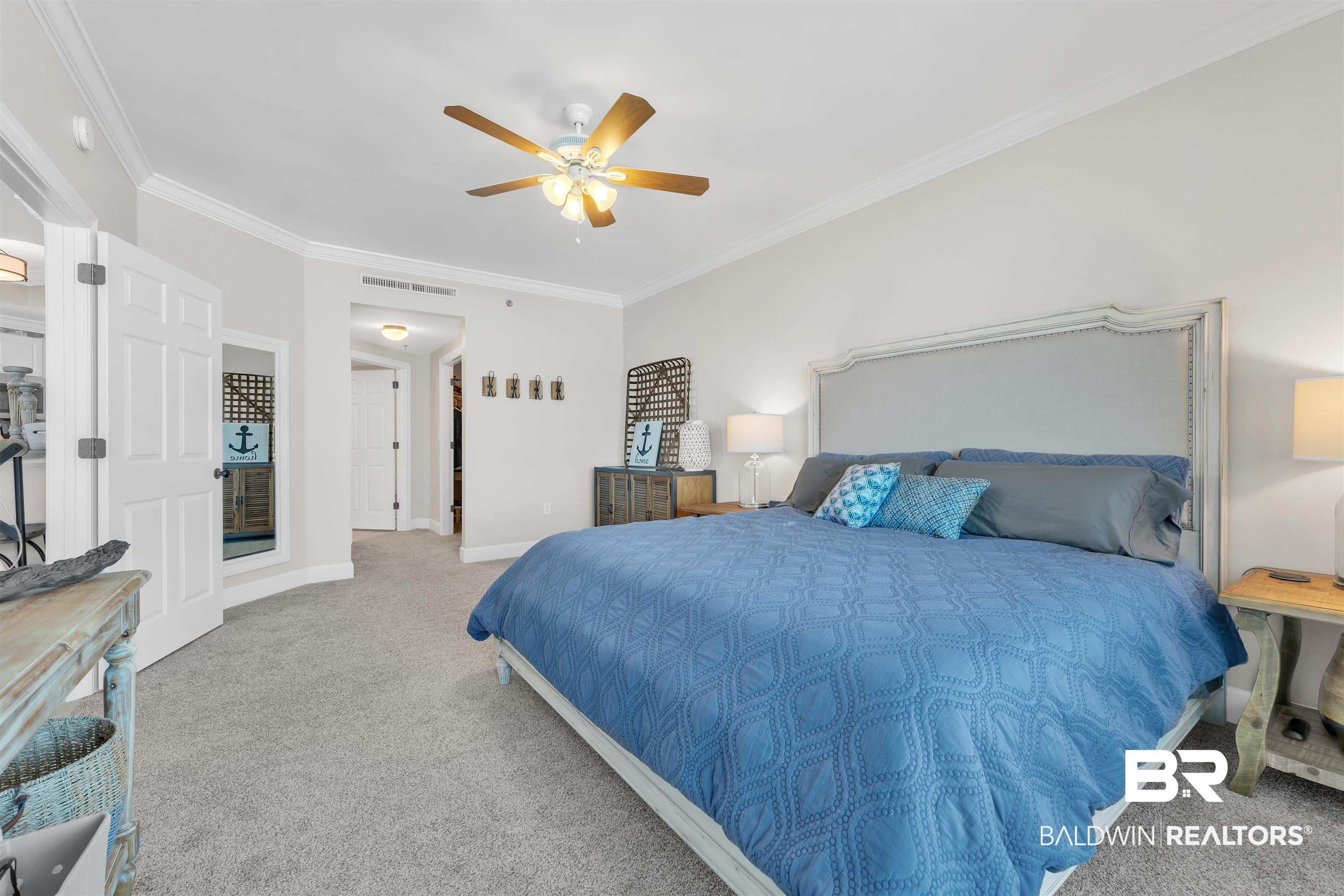 27582 Canal Road, Unit 2605 Orange Beach, AL 36561 - Photo 16 of 41 Carpeted bedroom featuring crown molding, a ceiling fan, and baseboards