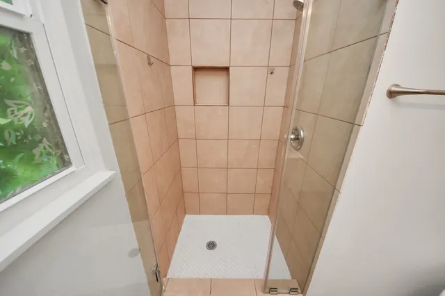 a bathroom with a sink and a shower