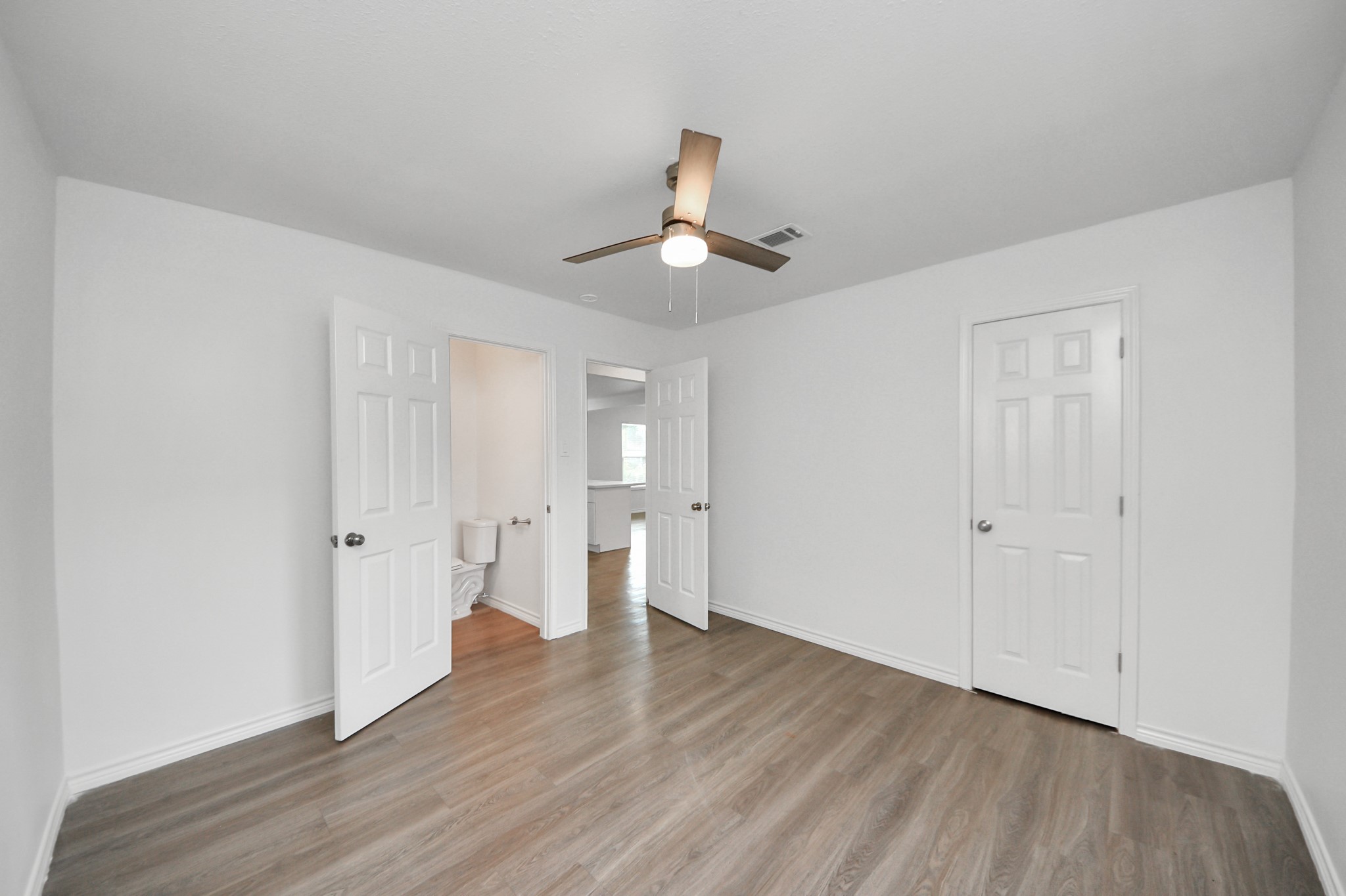 7004 Conley Street Houston, TX 77021 - Photo 15 of 32 wooden floor in an empty room with a window