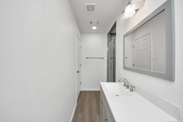 a bathroom with a bathtub and a sink