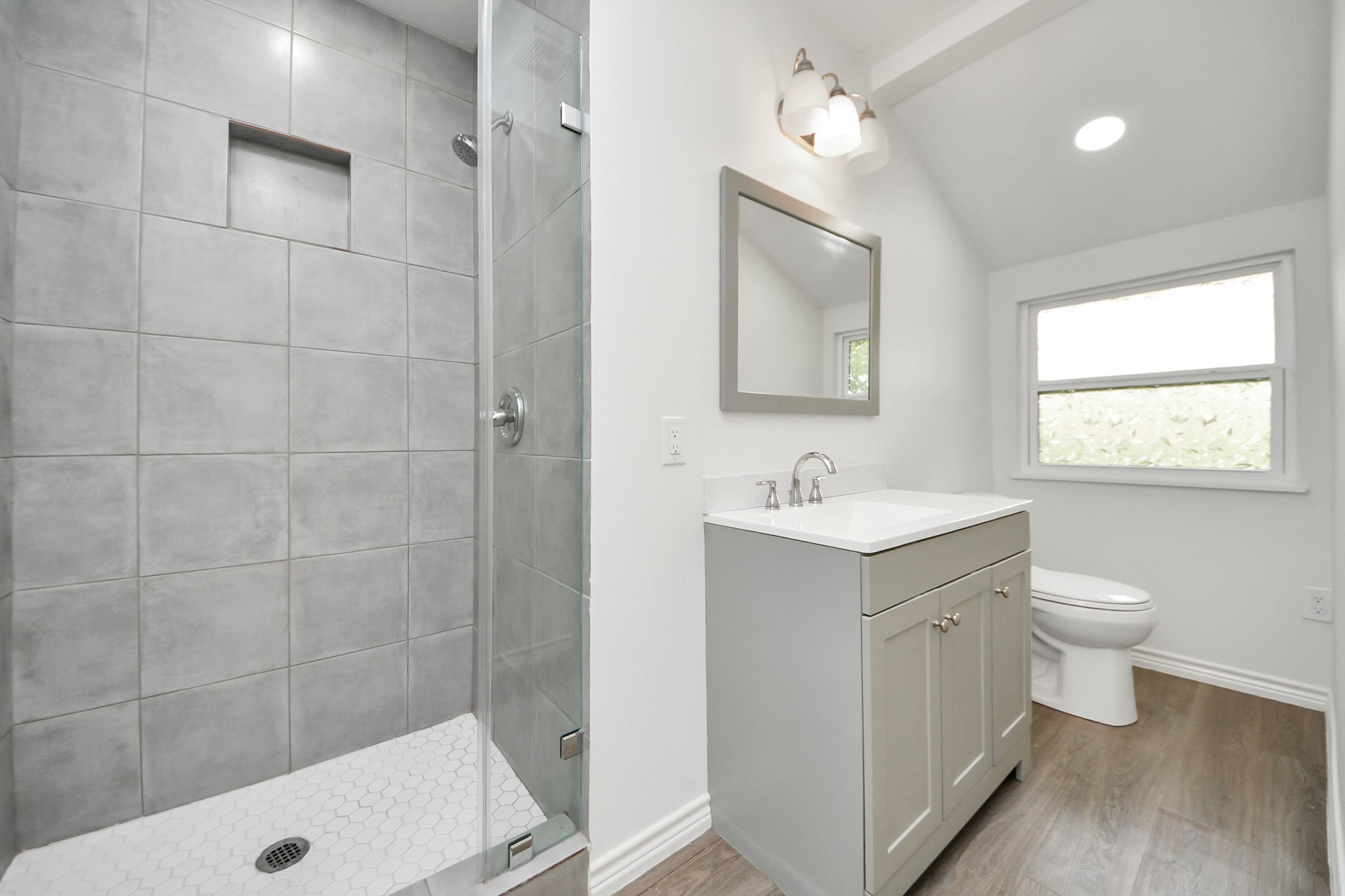 7004 Conley Street Houston, TX 77021 - Photo 18 of 32 a bathroom with a sink a toilet and shower
