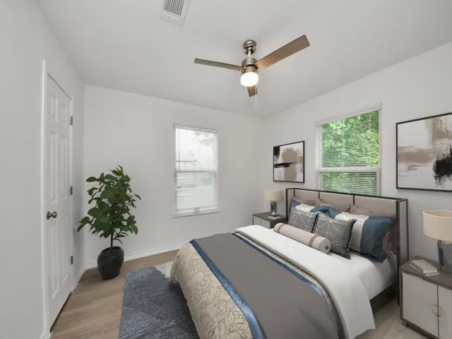 a bedroom with a bed and a window