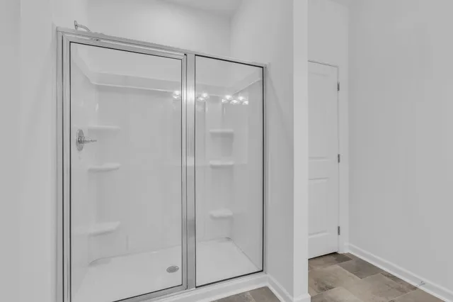 a bathroom with a sink and shower