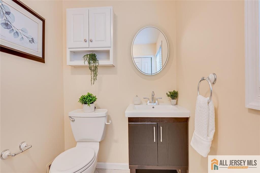 19 Oxford Road East Brunswick, NJ 08816 - Photo 12 of 41 a bathroom with a toilet a sink and mirror