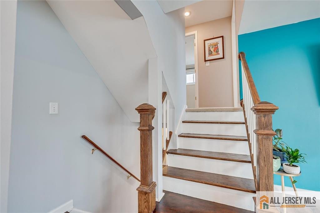 19 Oxford Road East Brunswick, NJ 08816 - Photo 17 of 41 a view of staircase with white walls and a window