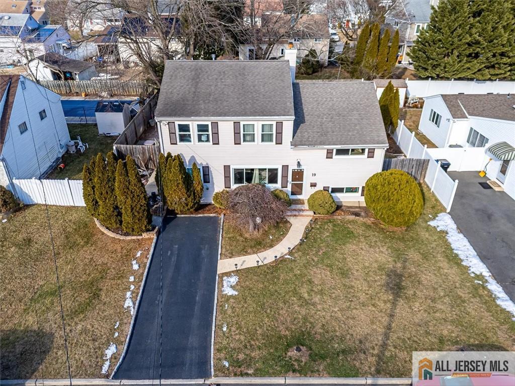 19 Oxford Road East Brunswick, NJ 08816 - Photo 3 of 41 an aerial view of a house with swimming pool and large trees