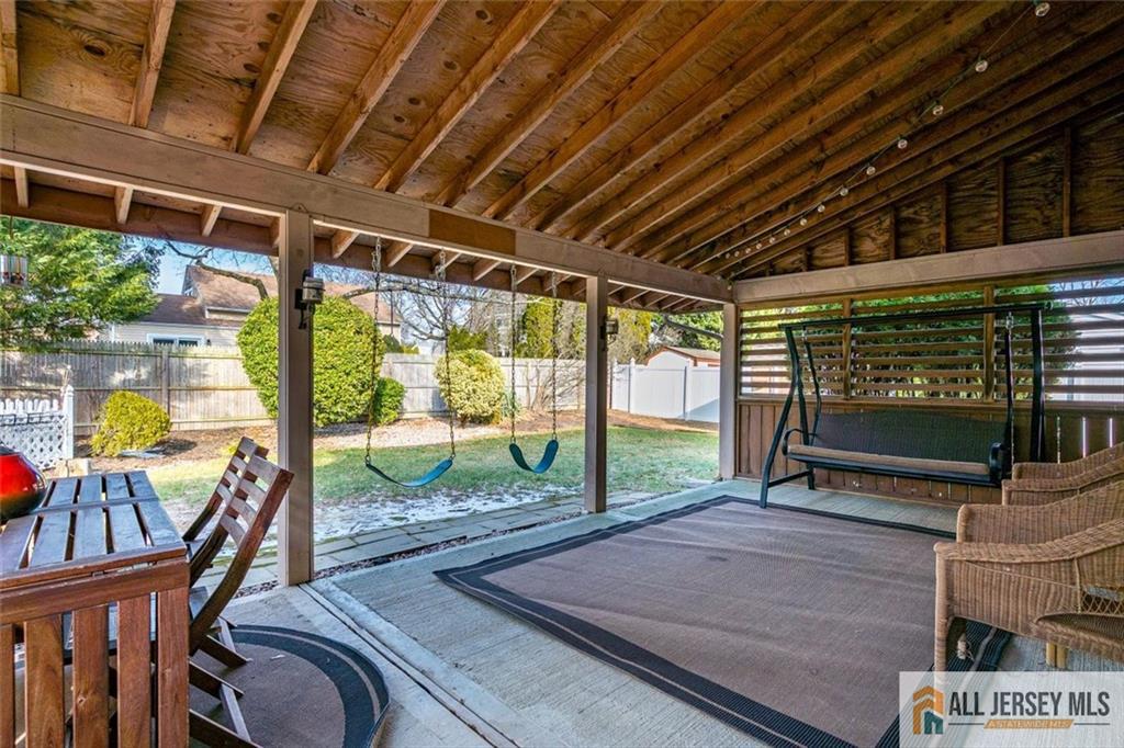 19 Oxford Road East Brunswick, NJ 08816 - Photo 32 of 41 a view of a porch with furniture and a yard