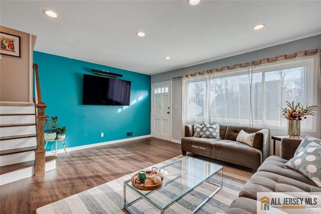 19 Oxford Road East Brunswick, NJ 08816 - Photo 6 of 41 a living room with furniture and a flat screen tv