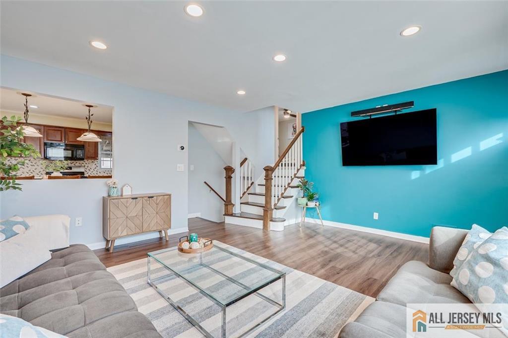 19 Oxford Road East Brunswick, NJ 08816 - Photo 7 of 41 a living room with furniture and a flat screen tv