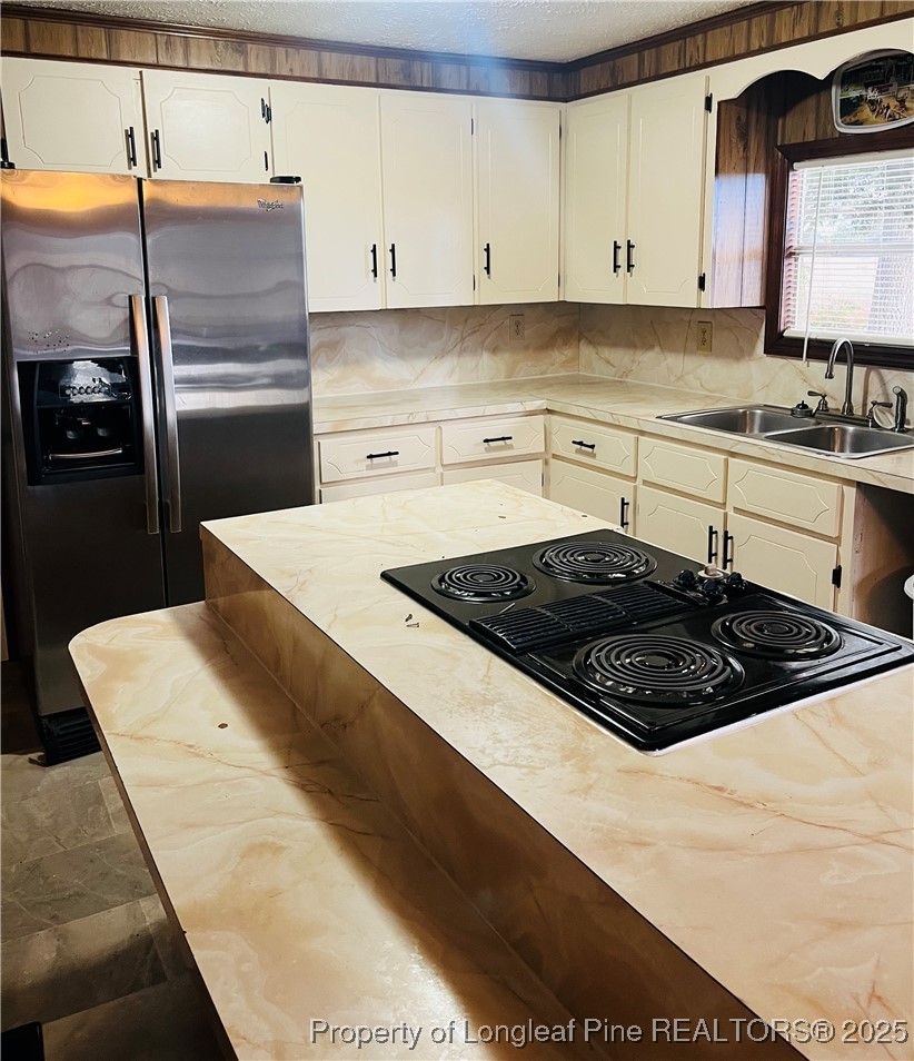 1922 Evergreen Church Road Pembroke, NC 28372 - Photo 13 of 31 a kitchen with a sink a stove and refrigerator