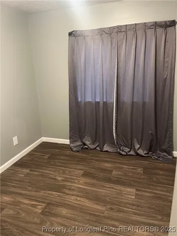 a view of a room with wooden walls