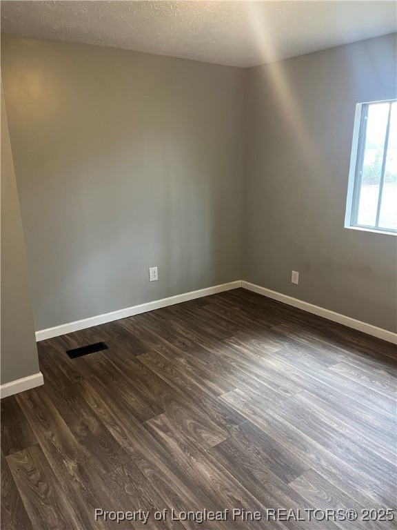 1922 Evergreen Church Road Pembroke, NC 28372 - Photo 23 of 31 a view of empty room with wooden floor and fan
