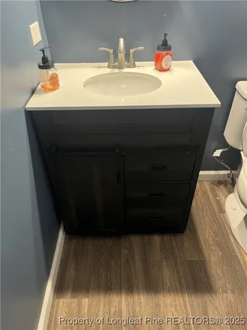 a white toilet sitting next to a bath tub