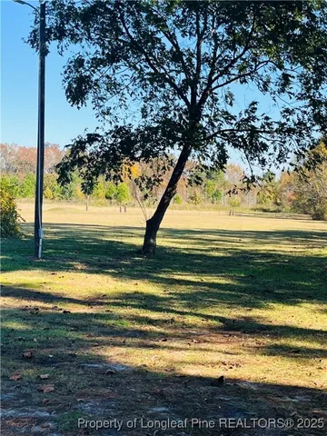 a view of an ocean and a yard