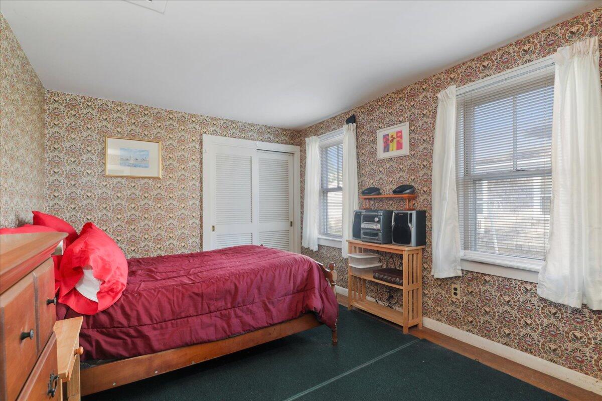 126 Commerce Road Barnstable, MA 02630 - Photo 16 of 30 a bedroom with a bed and a dresser