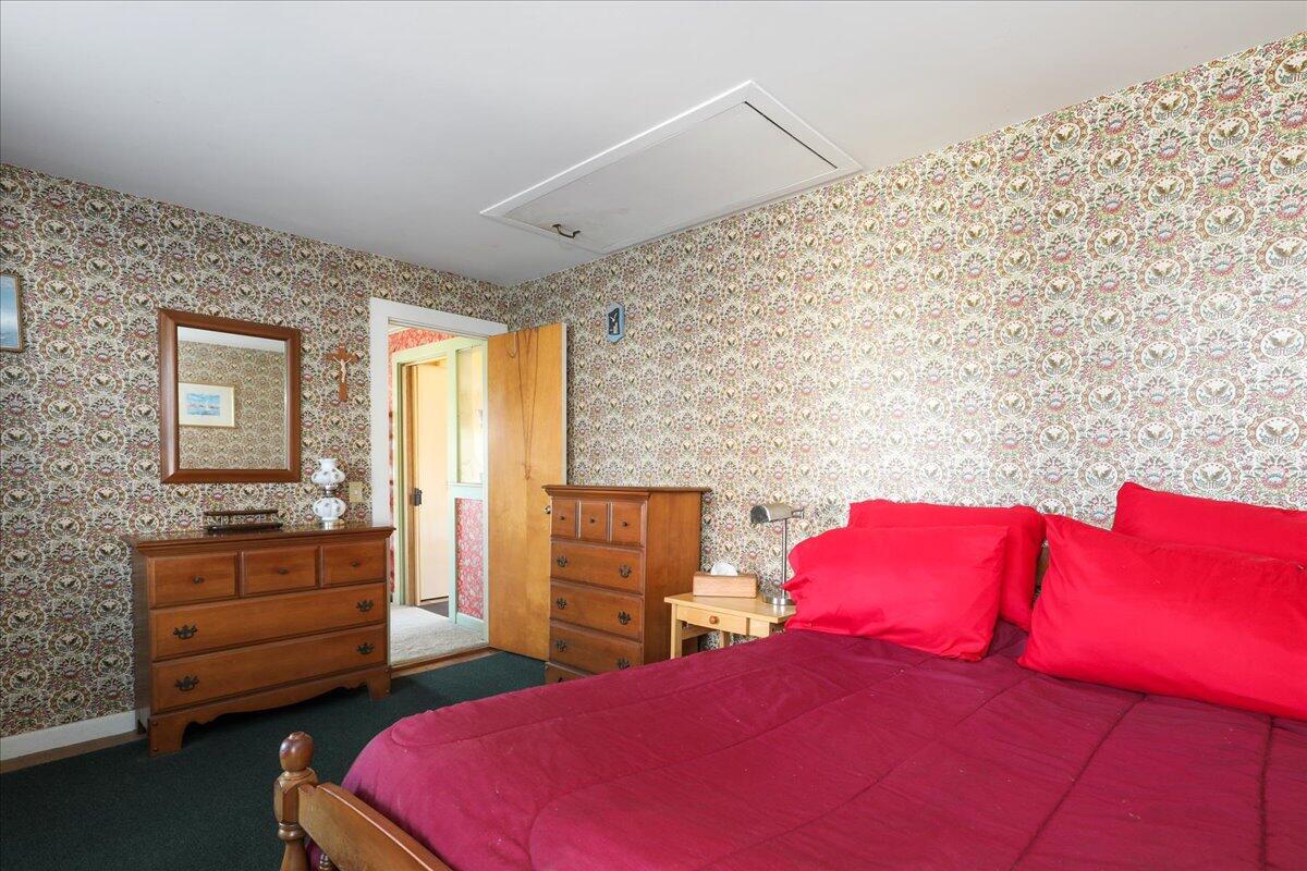 126 Commerce Road Barnstable, MA 02630 - Photo 17 of 30 a bedroom with a bed and dresser