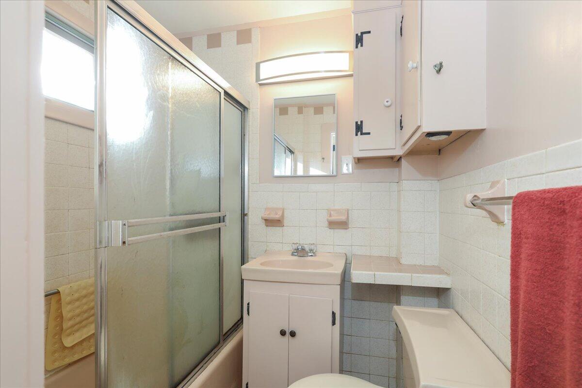 126 Commerce Road Barnstable, MA 02630 - Photo 18 of 30 a bathroom with a sink a toilet and shower