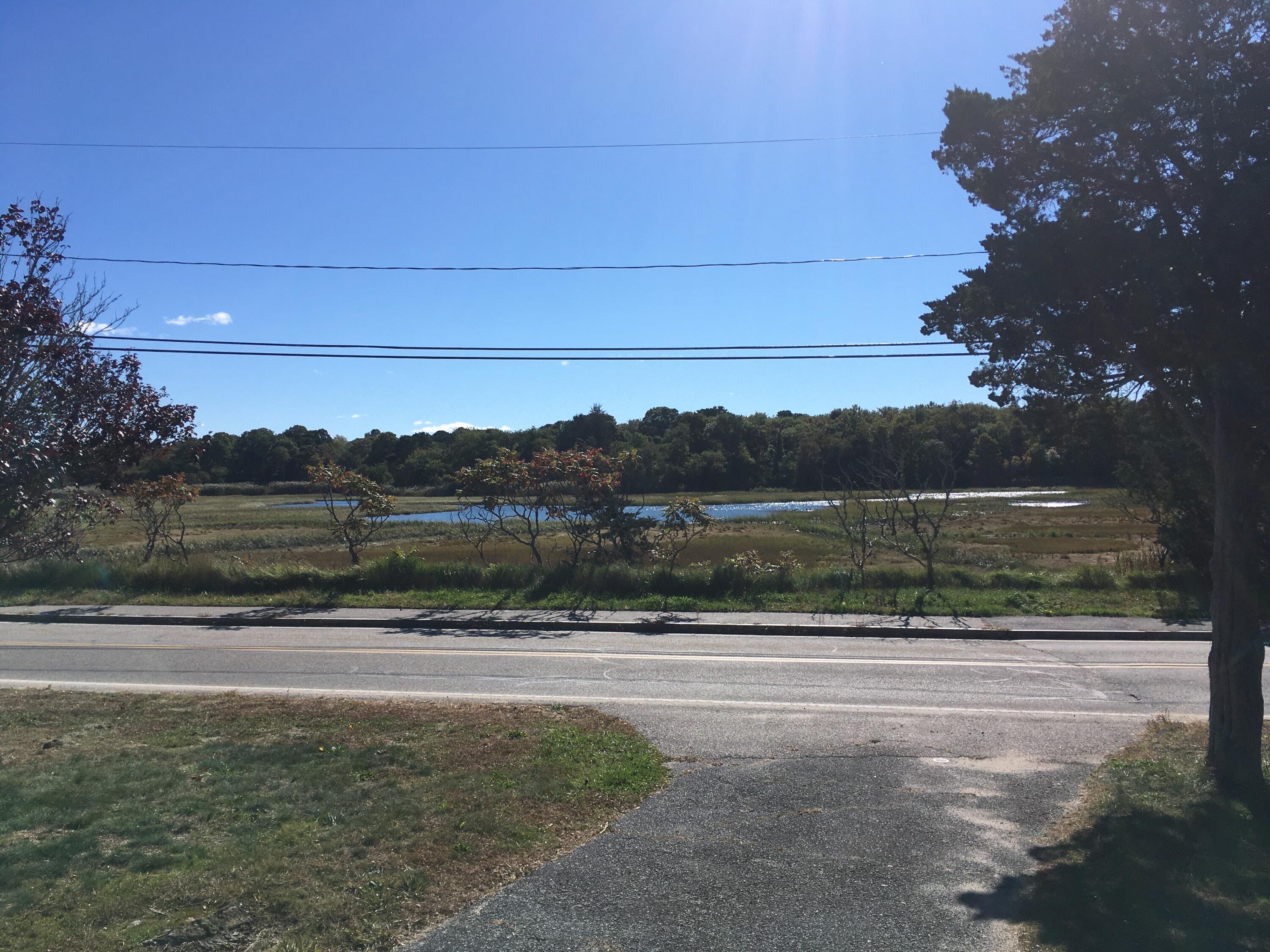 126 Commerce Road Barnstable, MA 02630 - Photo 2 of 30 a view of lake with mountain in the background