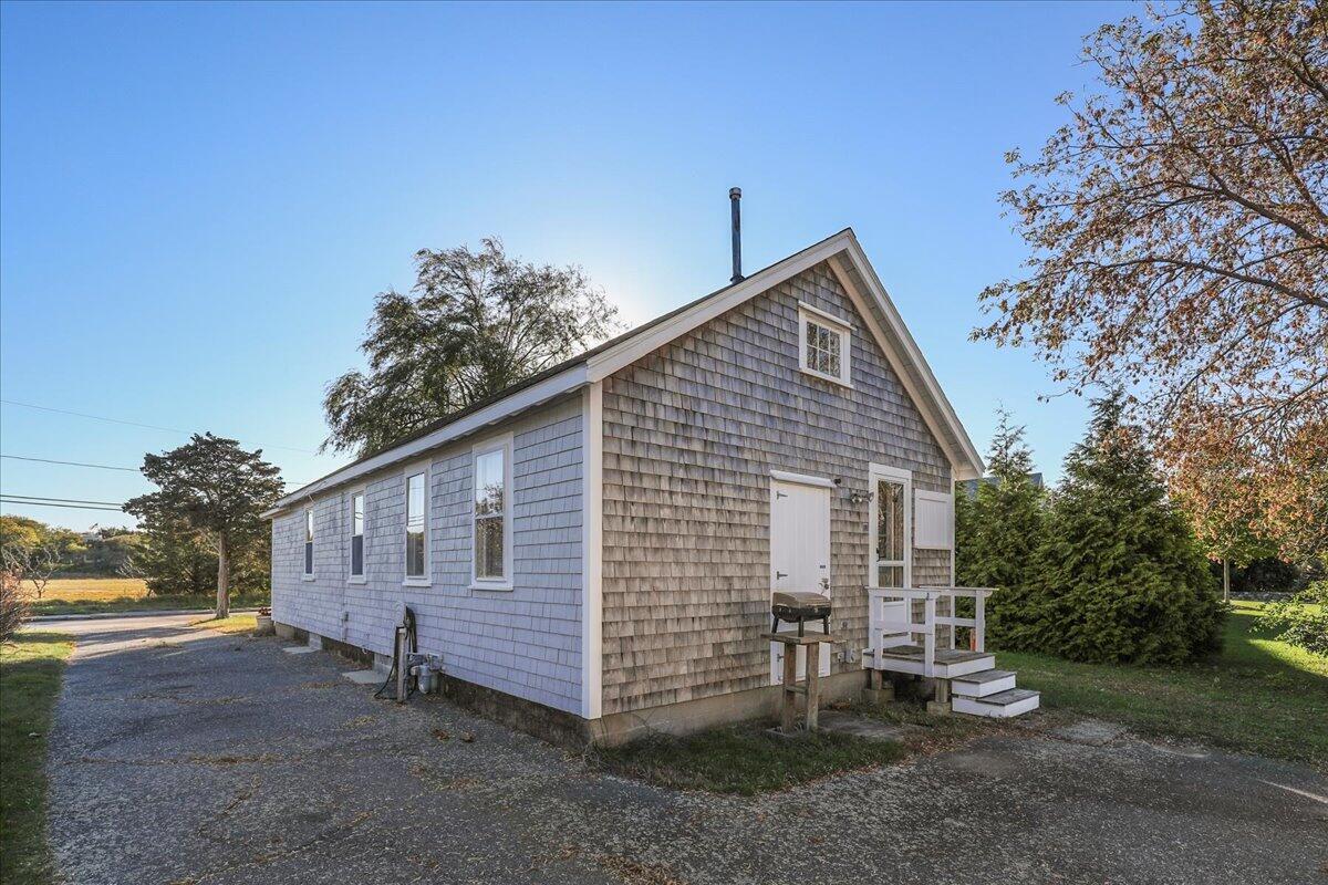 126 Commerce Road Barnstable, MA 02630 - Photo 21 of 30 a view of a house with a yard
