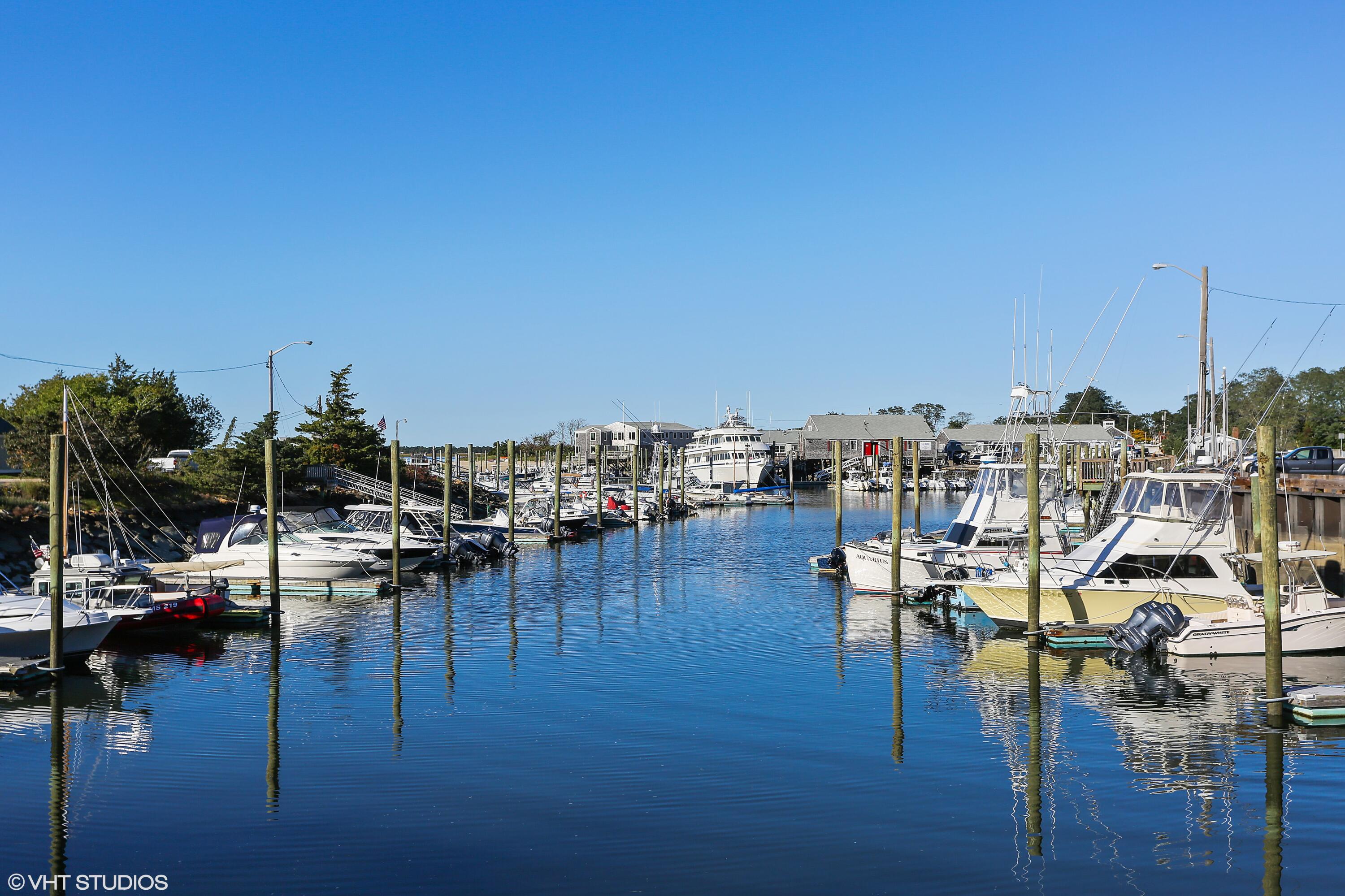 126 Commerce Road Barnstable, MA 02630 - Photo 25 of 30 a view of water with boats and trees in the background