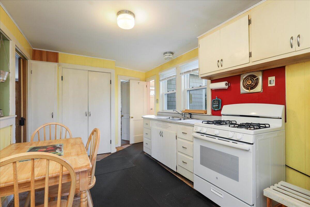126 Commerce Road Barnstable, MA 02630 - Photo 9 of 30 a kitchen with stainless steel appliances granite countertop a stove a sink and a refrigerator