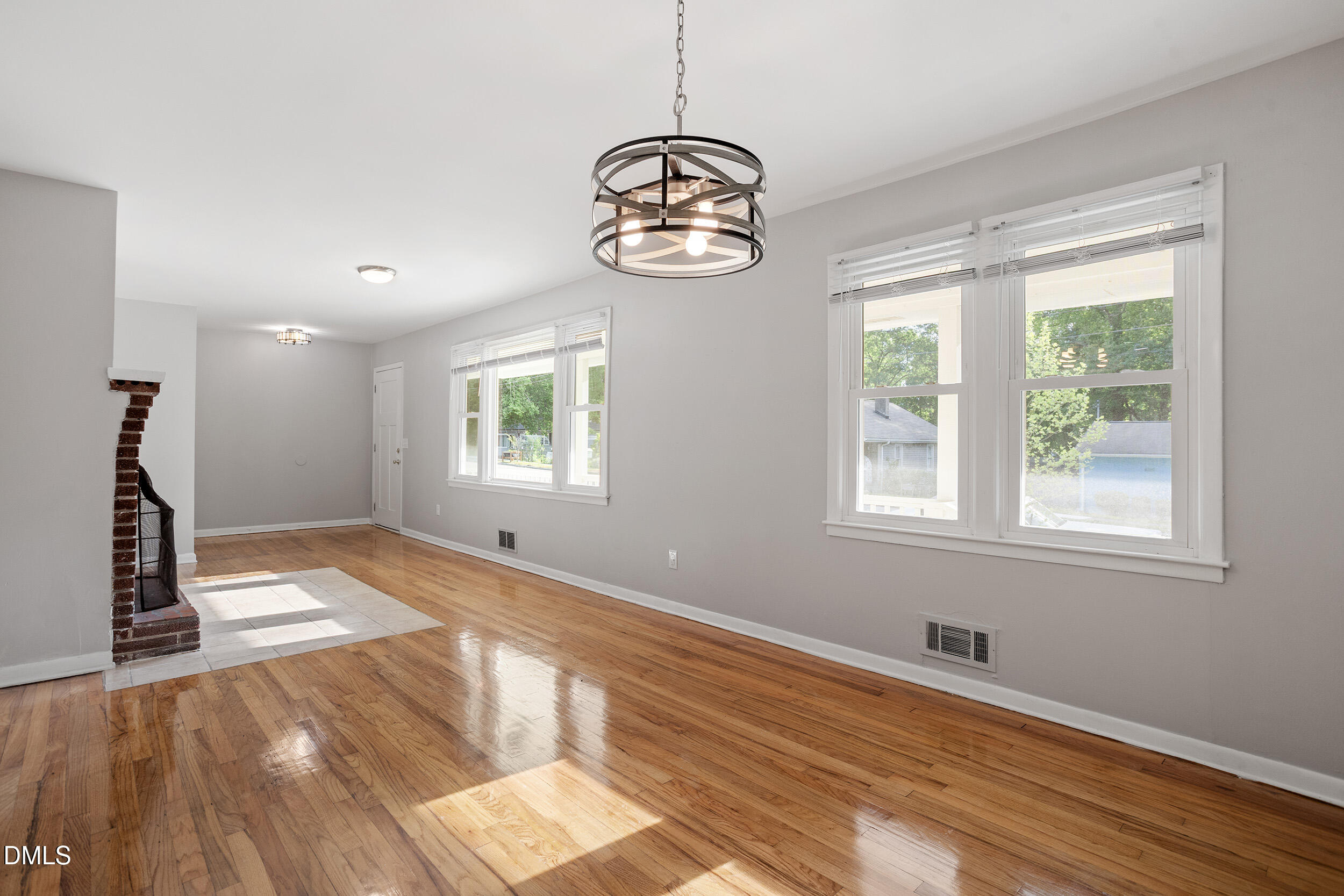 2414 Chapin Street Durham, NC 27707 - Photo 8 of 30 a view of an empty room with wooden floor and a window