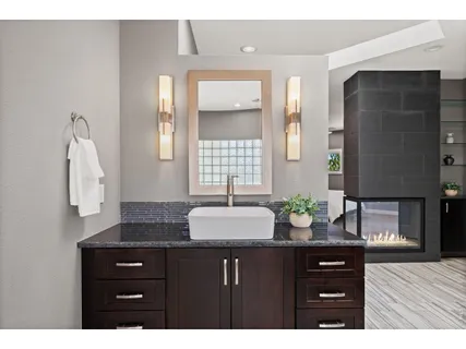 a bathroom with a sink and a mirror
