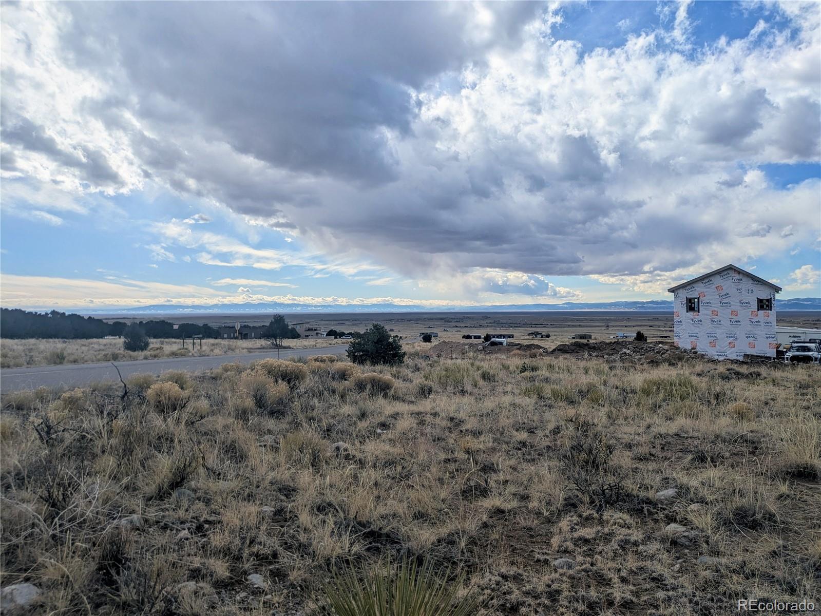 3288 Camino Del Rey Crestone, CO 81131 - Photo 8 of 11 a view of a dry yard with wooden fence