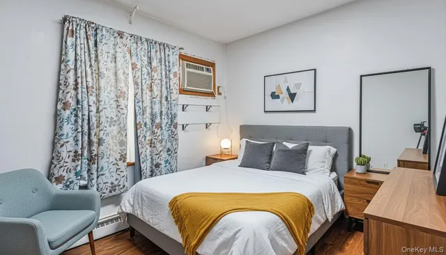 a bedroom with a bed and a couch