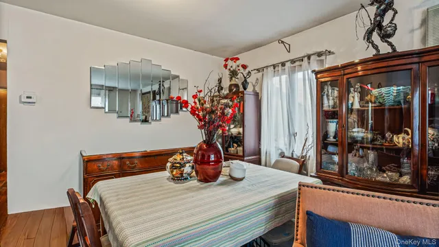 a dining room with a table and chairs