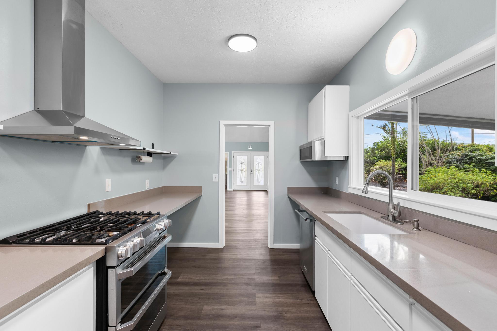 234 Kipa Street Hilo, HI 96720 - Photo 3 of 30 a kitchen with a stove and a sink
