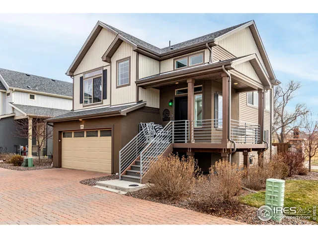 a front view of a house with garage