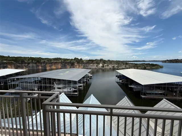 a terrace of a house with wooden floor and city view