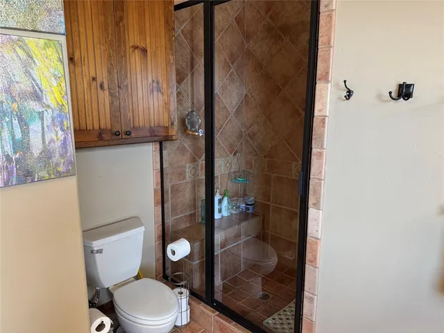 a bathroom with a tub a sink and a window