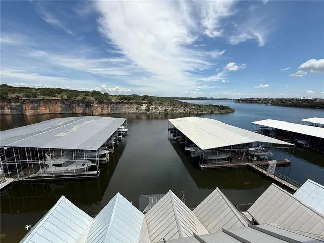 a terrace with outdoor seating and kitchen view