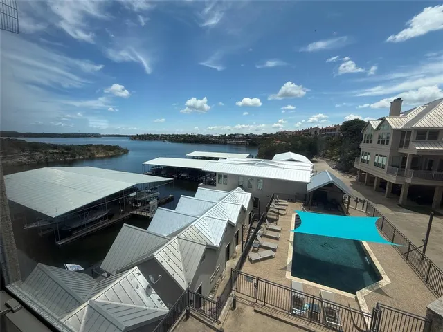a view of a hallway with wooden floor and stairs