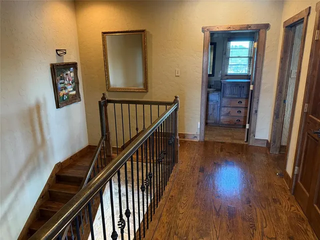 a view of a chairs and table on the roof deck
