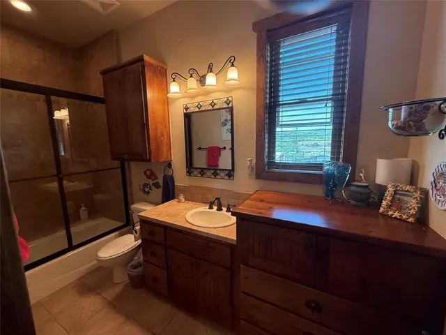 a bathroom with a sink double vanity and a mirror