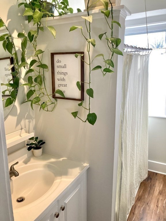 946 Bay Road, Unit 3 Hamilton, MA 01982 - Photo 10 of 13 a bathroom with a sink and mirror