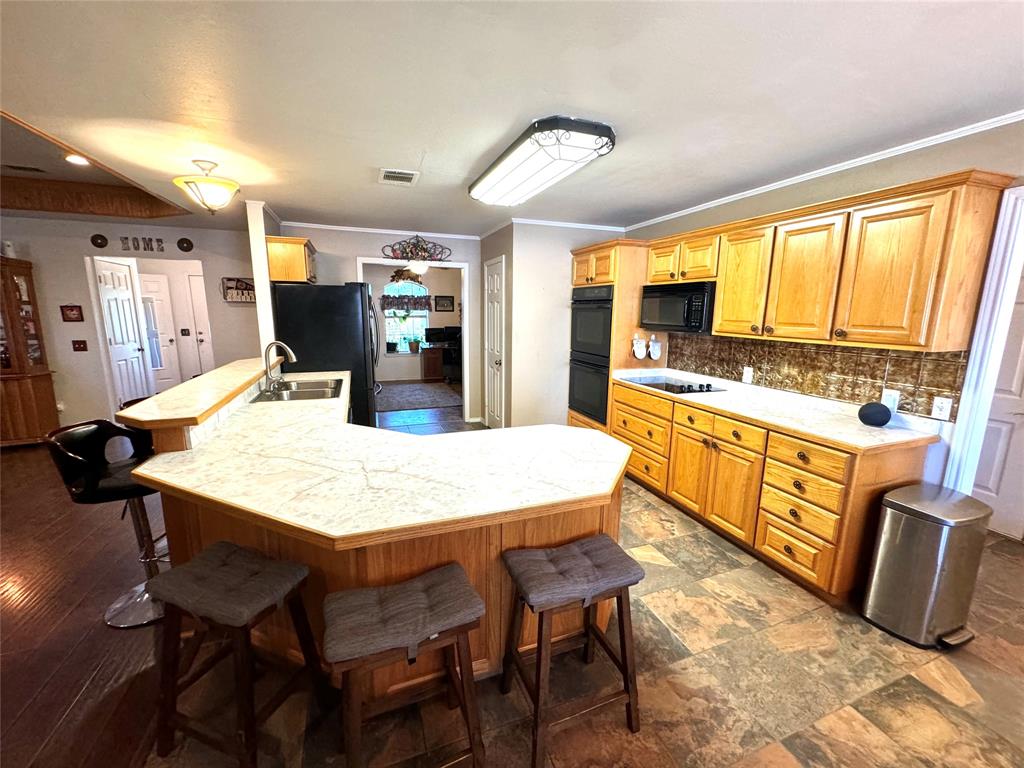505 3rd Street Dodd City, TX 75438 - Photo 30 of 37 a large kitchen with a table and chairs
