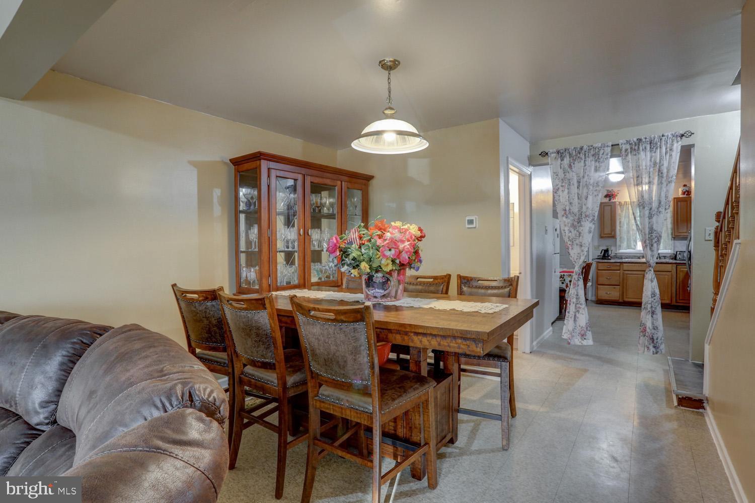 417 Green Street Lancaster, PA 17602 - Photo 13 of 37 a view of a dining room with furniture and chandelier
