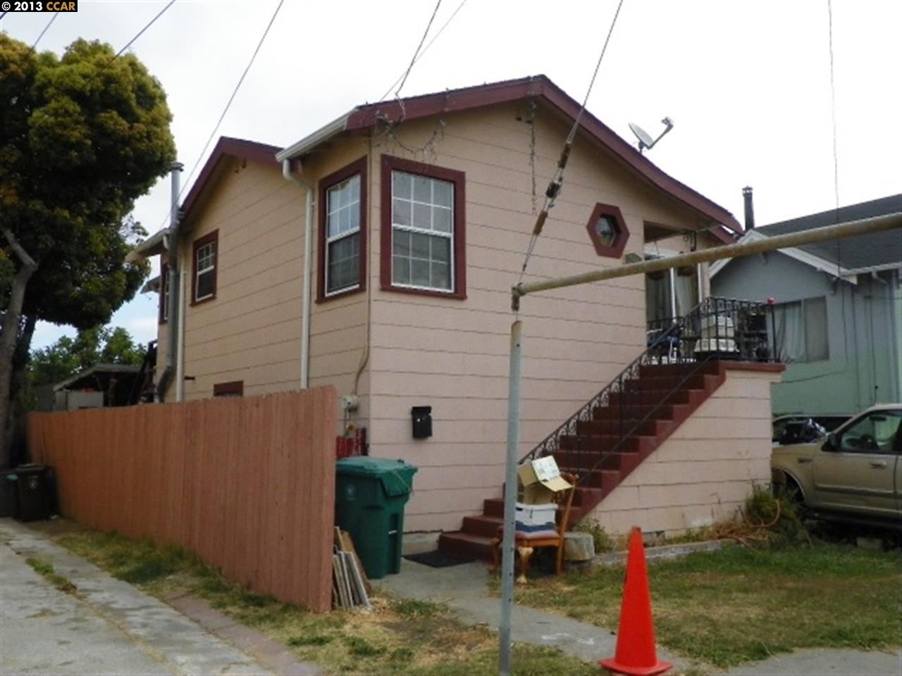 744 Second Street Rodeo, CA 94572 - Photo 1 of 1 a view of a white house with a small yard and wooden fence
