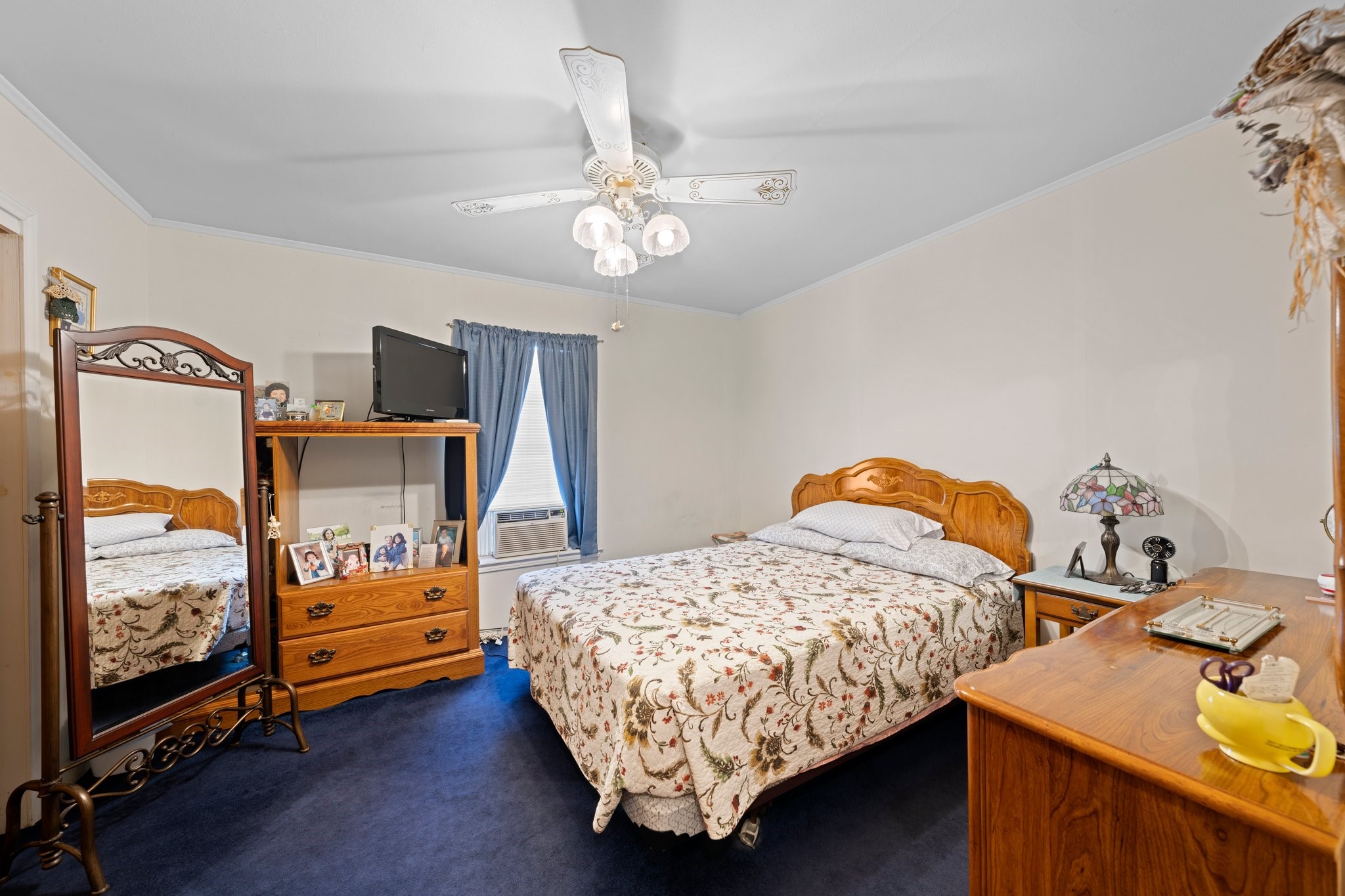 208 Francisco Lemos Street Kerrville, TX 78028 - Photo 16 of 29 a bedroom with bed and a chandelier